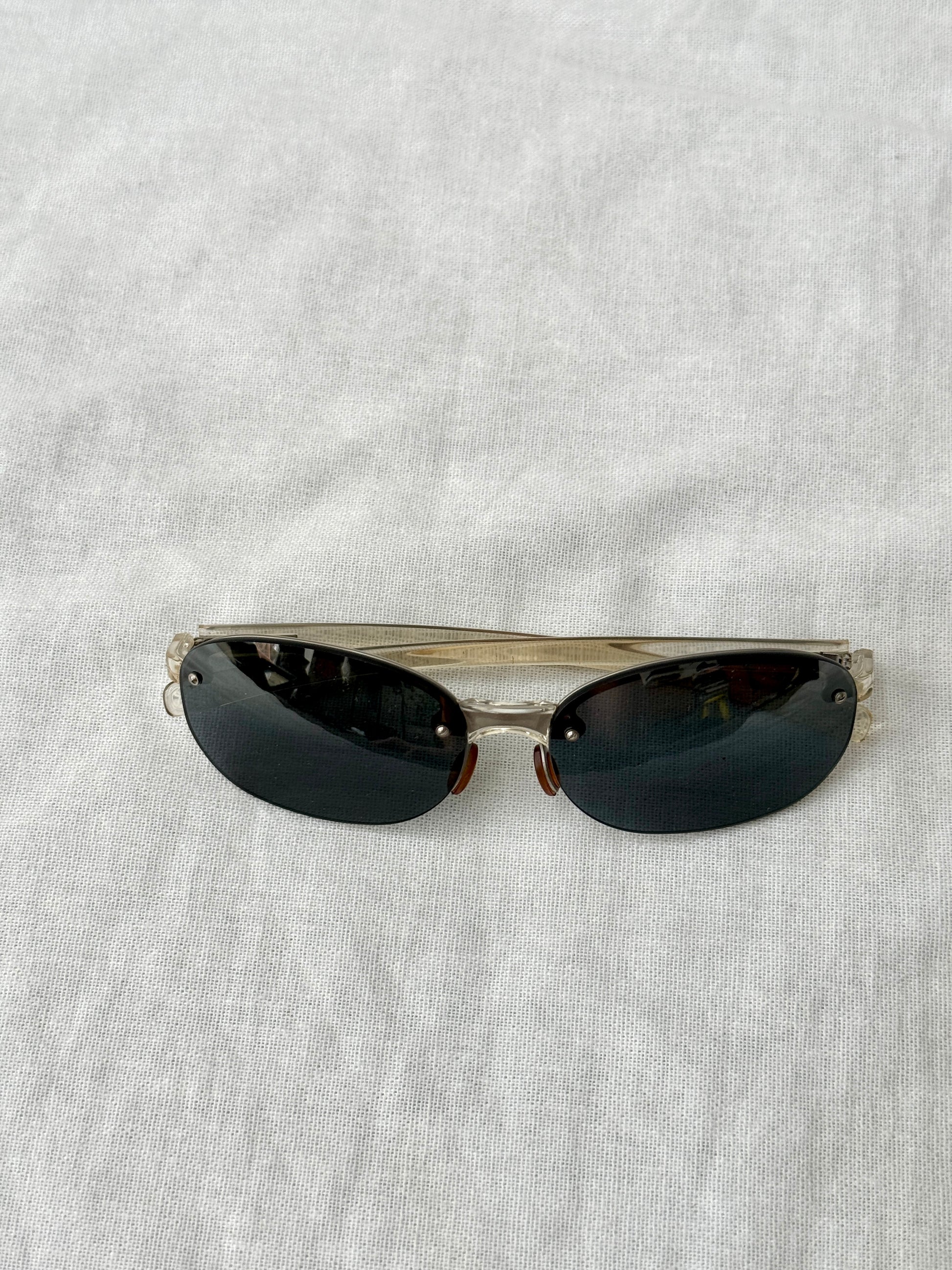 Prada Round Rimless Sunglasses