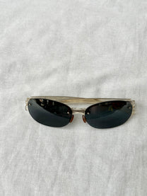 Prada Round Rimless Sunglasses
