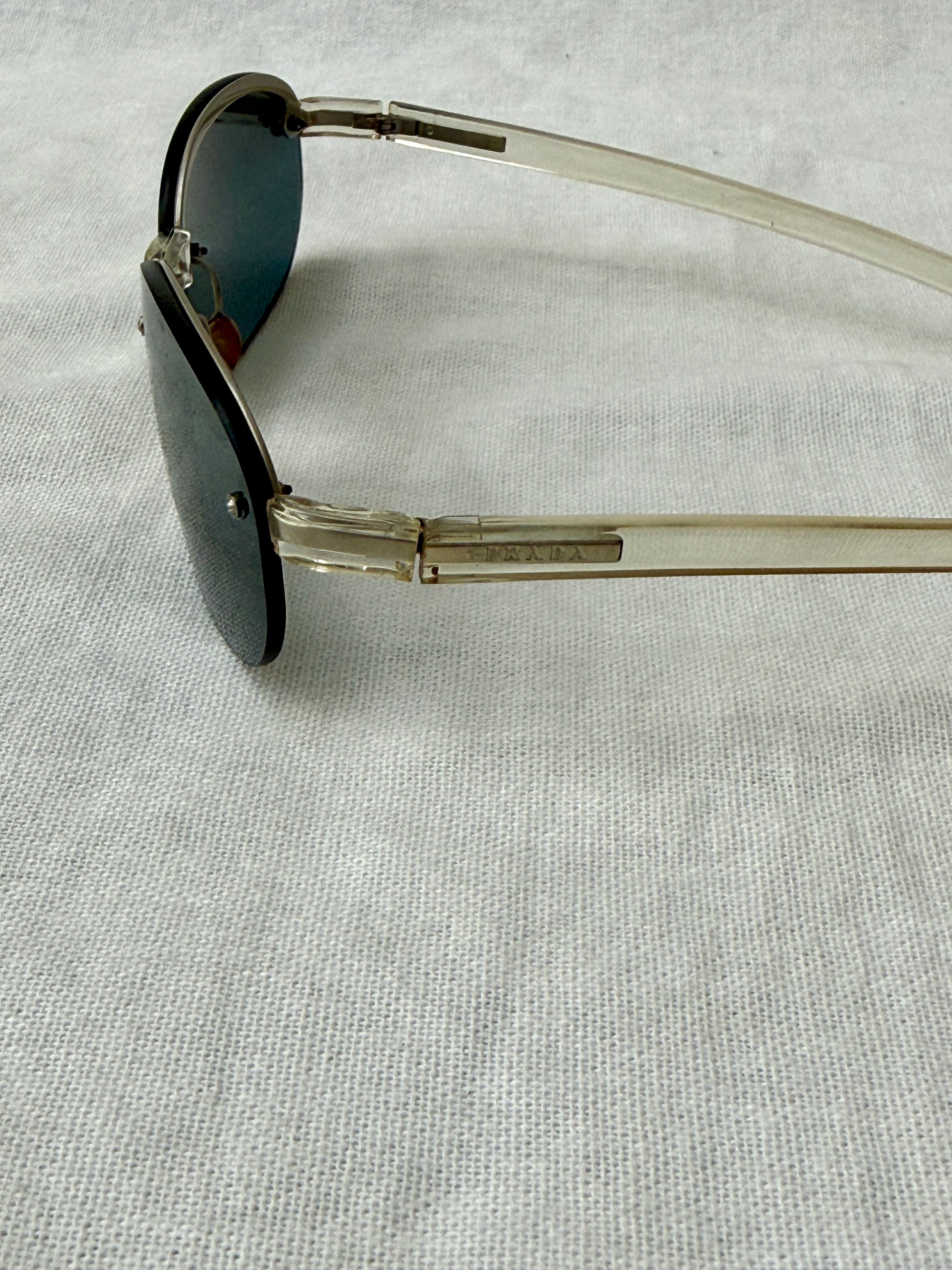 Prada Round Rimless Sunglasses