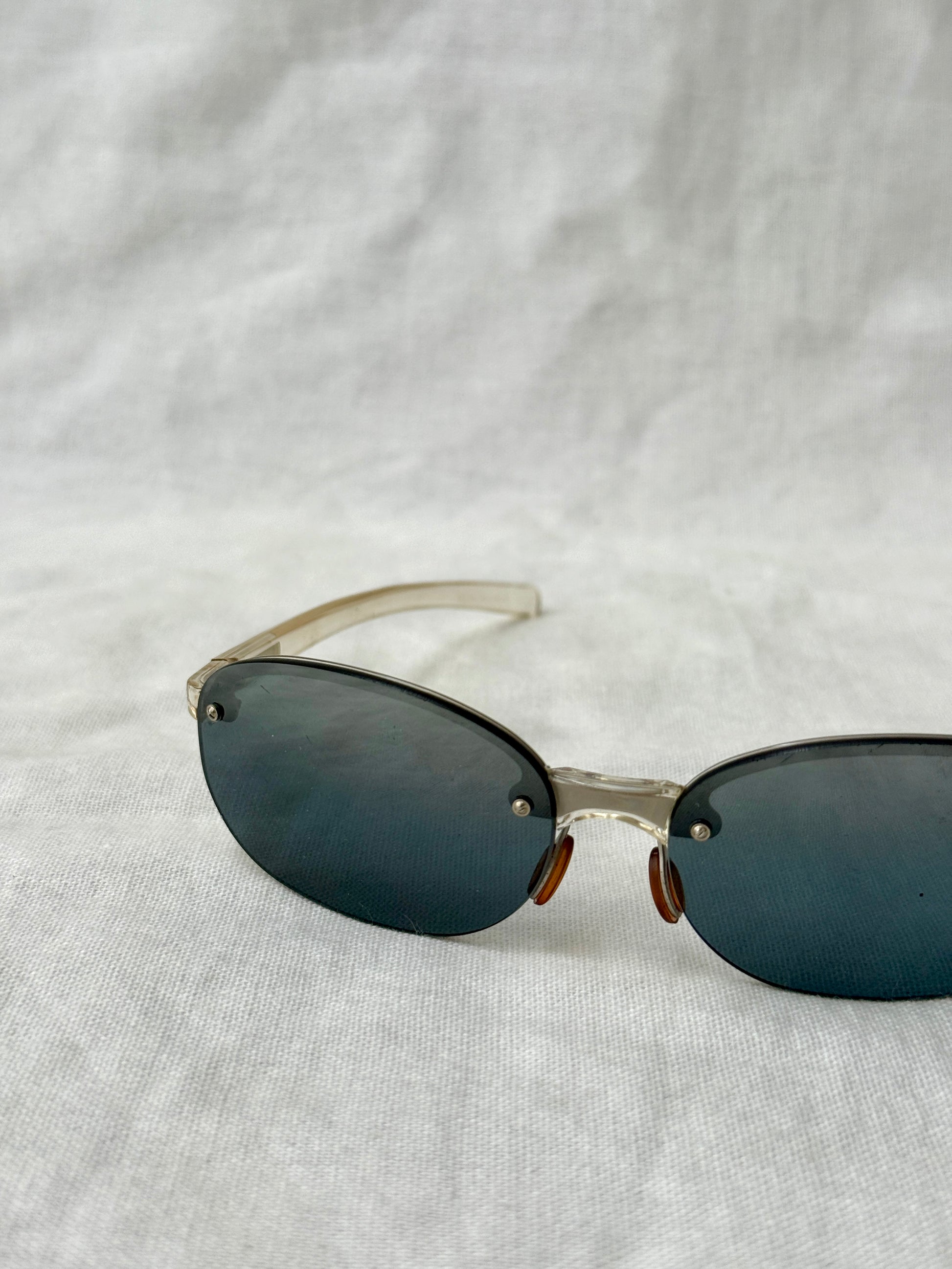 Prada Round Rimless Sunglasses