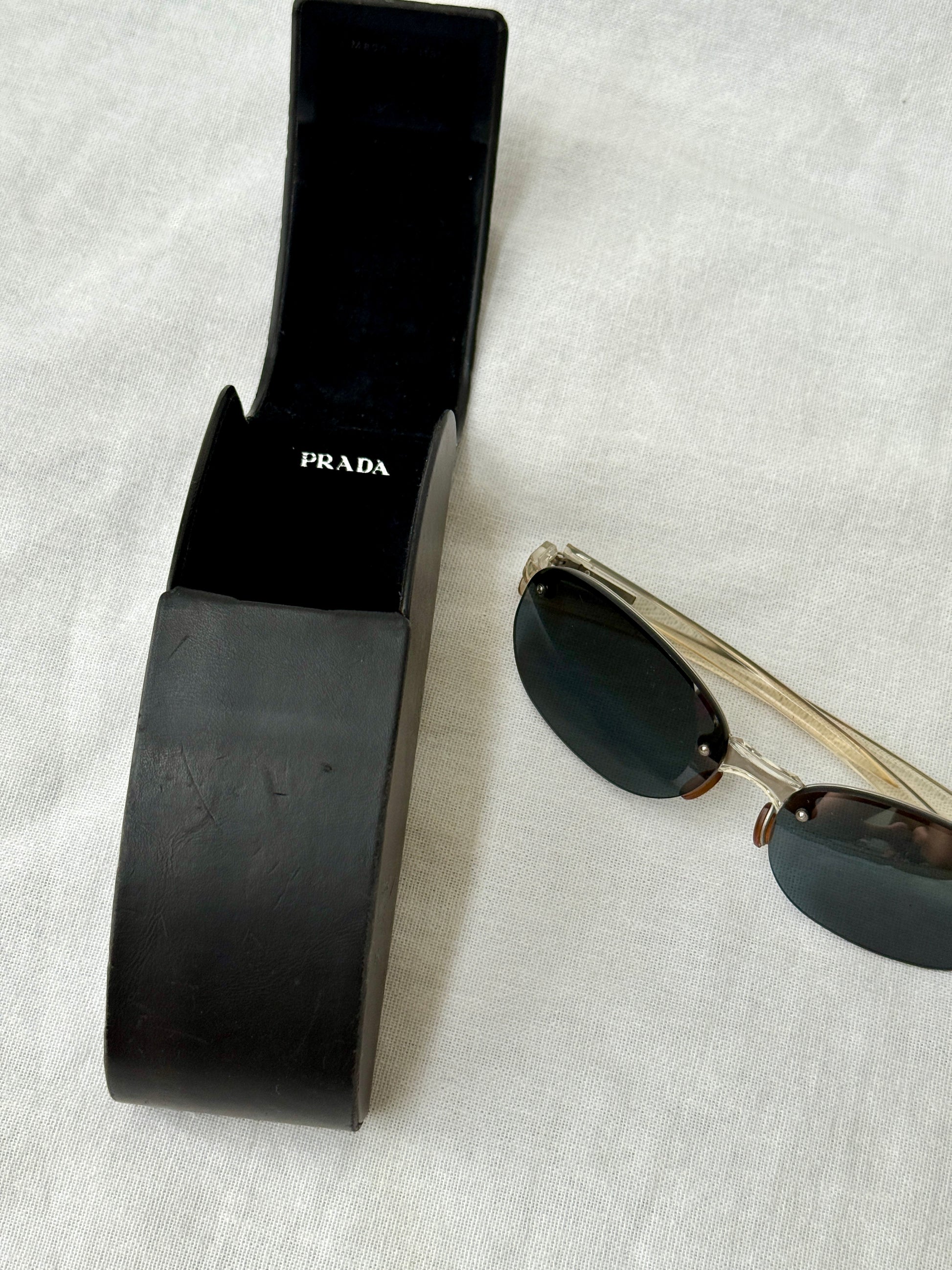 Prada Round Rimless Sunglasses