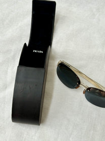 Prada Round Rimless Sunglasses