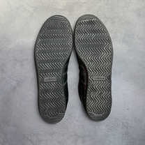 SĀN ARCHIVE GOODS Adidas Y-3 Japan leather sneakers showing the black rubber outsoles with a herringbone tread pattern.